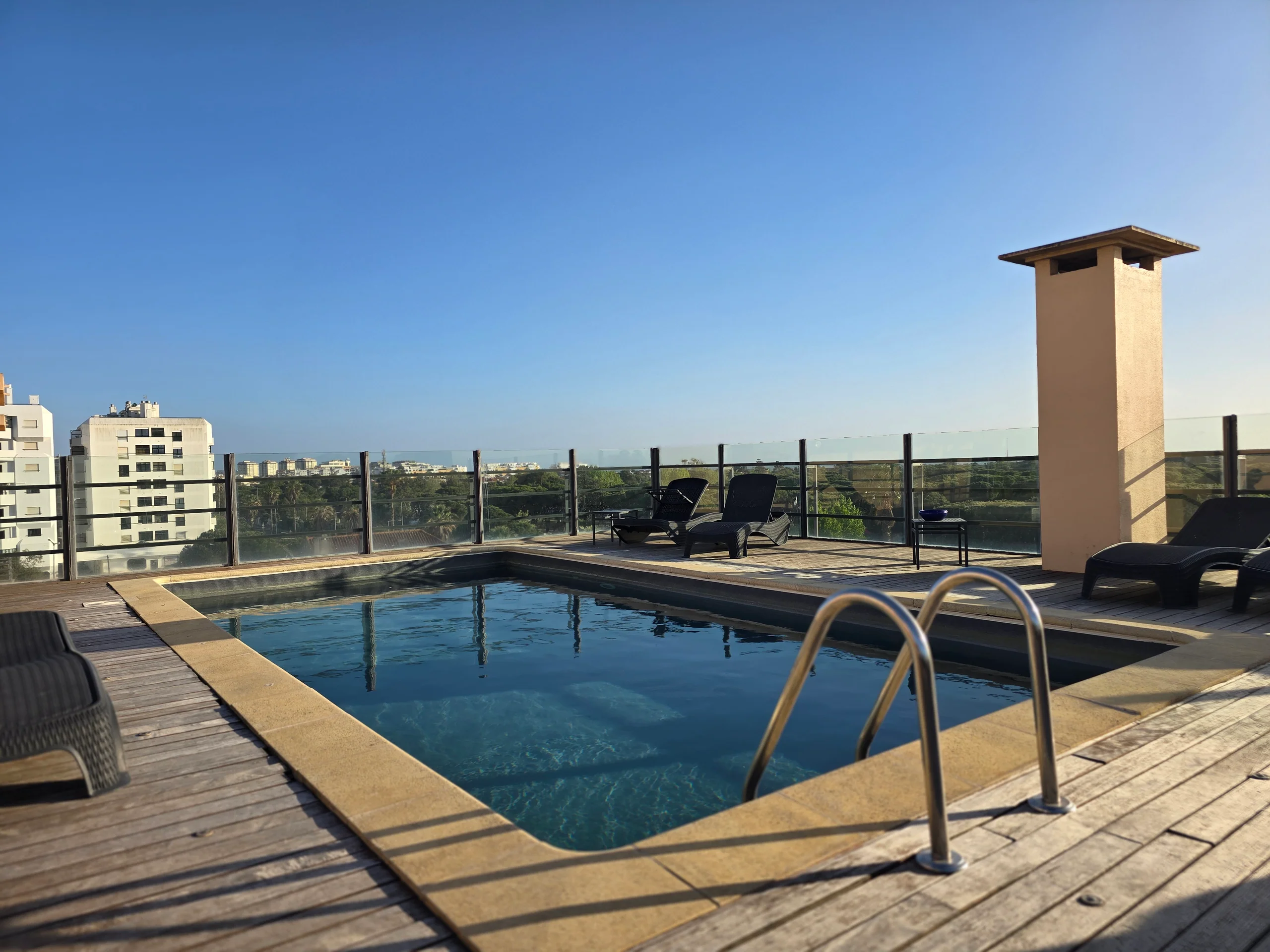 Rooftop pool with Atlantic view at golden hour